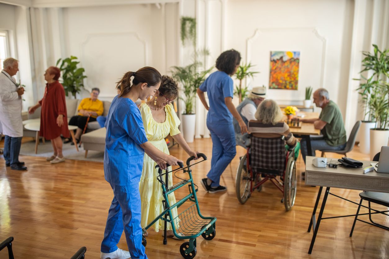 Staff helping members at an adult day center